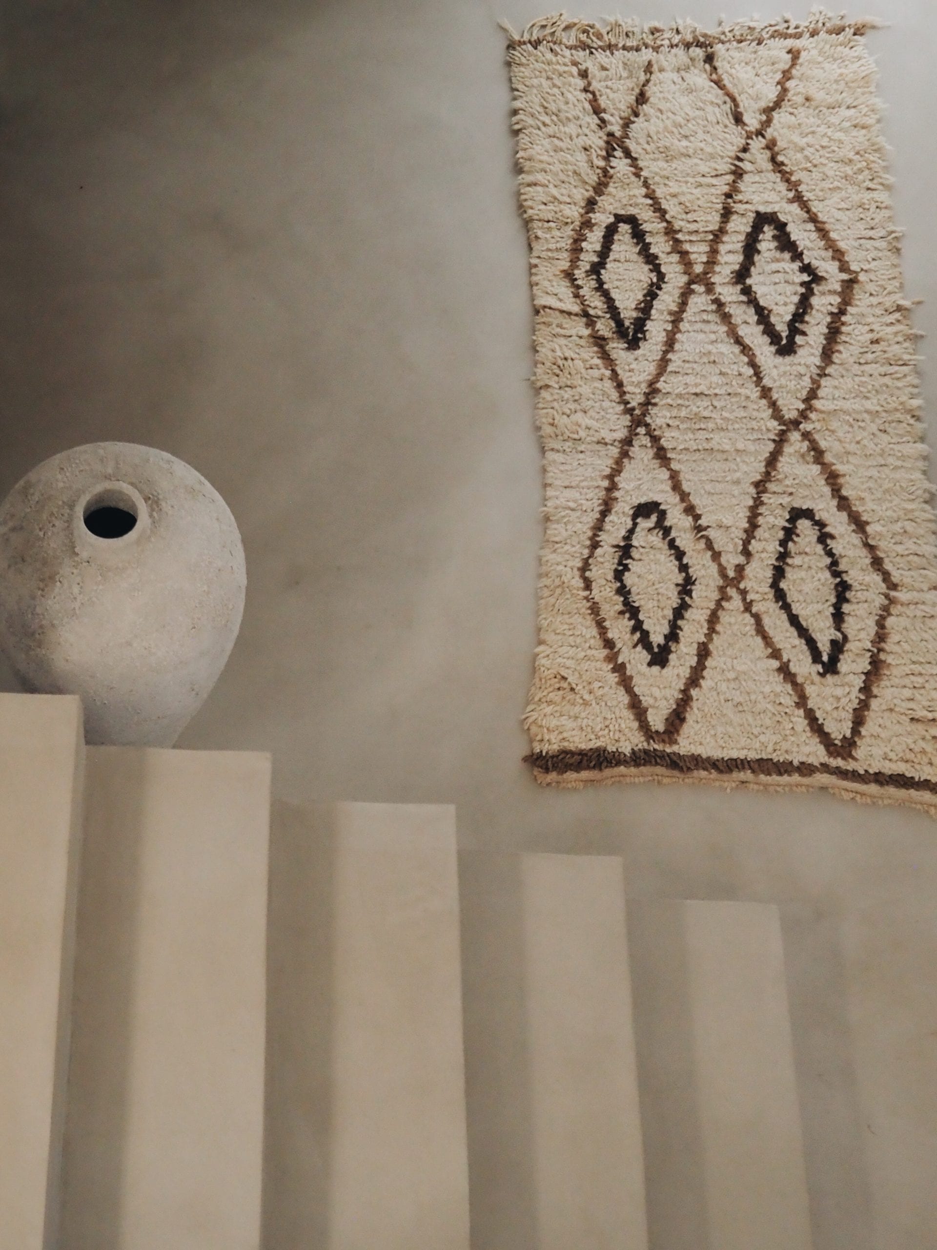 Neutral earth tones and Moroccan rug at Villa Son Font in Mallorca, Spain